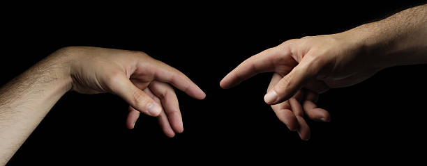 istock Genesis - Two Hands Touching like God and Adam 147282353
