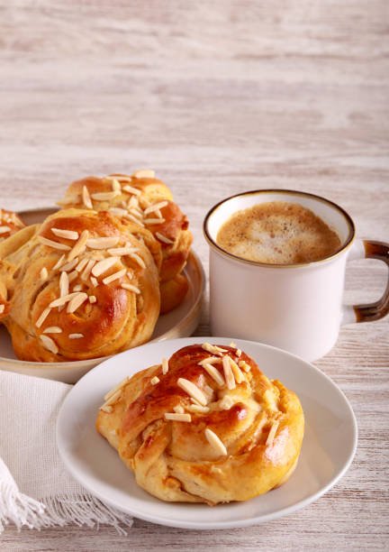 Cream and almond buns, served with coffee