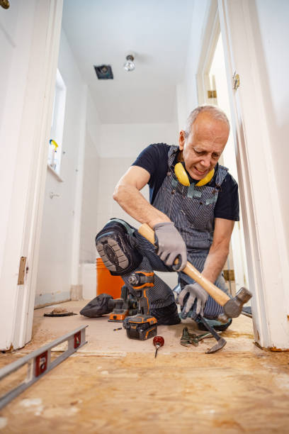 istock Senior Caucasian man doing construction renovation indoors 1472823726