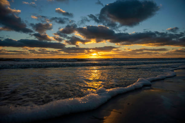 istock Ocean sunset landscape with soft evening sea water waves crushing on sandy beach 1472824068