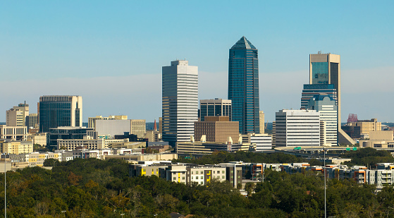 Aerial view of Jacksonville city with high office buildings. View from above of USA glass and steel high skyscraper architecture in modern american midtown.