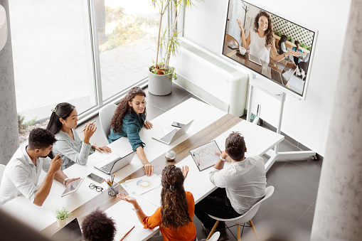 Video call group business people meeting on virtual workplace or remote office. Telework conference call using smart video technology to communicate colleague in professional corporate business