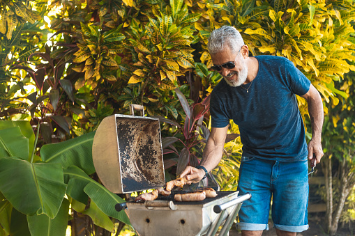 Man preparing barbecue outdoors