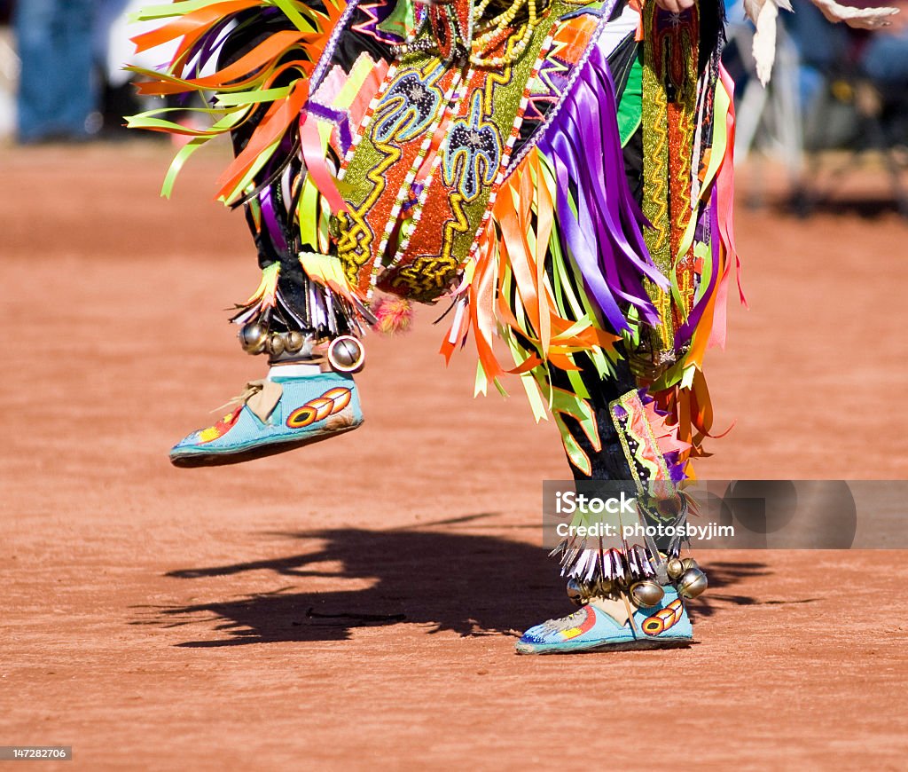 Colorful costume on the lower half of a pow wow dancer Native American dancers in traditonal rigalia perform during a Pow Wow. Indigenous Peoples of the Americas Stock Photo