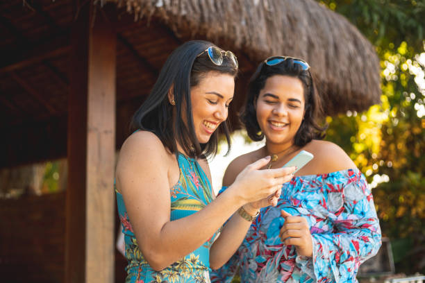 istock Women reading messages online on smartphone 1472827809