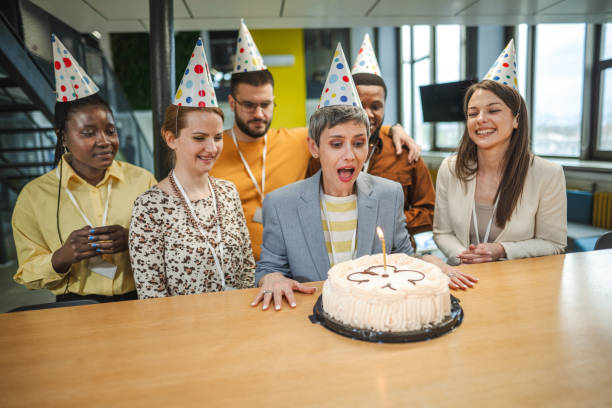 istock Business people celebrating achievement in the workplace 1472827894