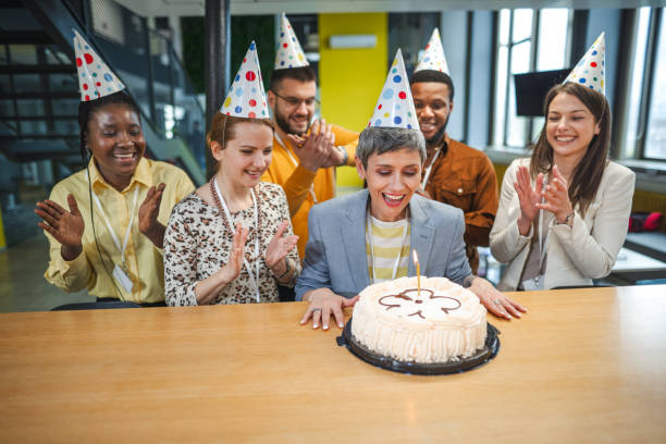 istock Business people celebrating achievement in the workplace 1472828031