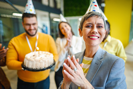 Business people celebrating achievement in the workplace