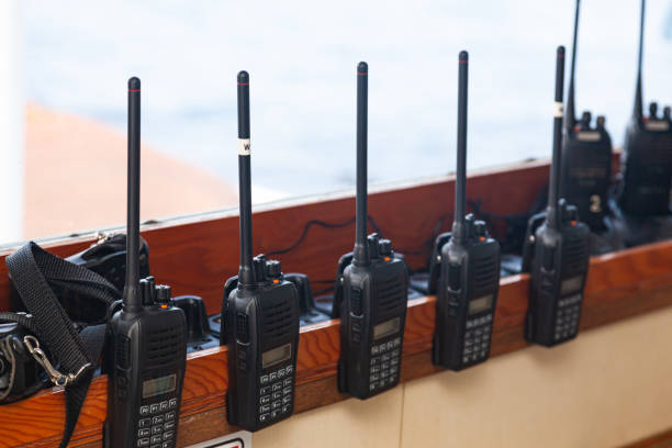 Lots of walkie-talkies attached on the windowsill, close-up. Lots of walkie-talkies attached on the windowsill, close-up. transceiver stock pictures, royalty-free photos & images