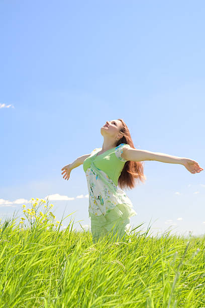 istock Beautiful woman in green field 147282932