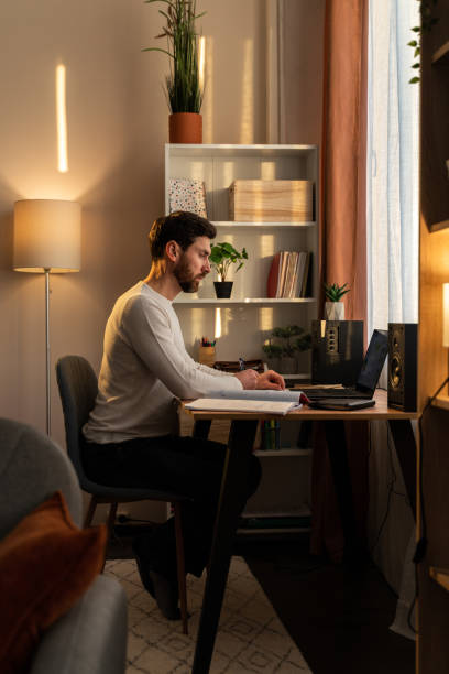 istock Overworked businessman at work. Stressed millennial man feeling concentrated while sitting 1472829576