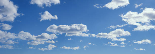 istock Beautiful white clouds in blue sky.  Cumulus clouds 1472832436