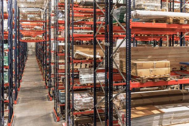 istock Warehouse with many shelves with cardboard boxes. 1472835317