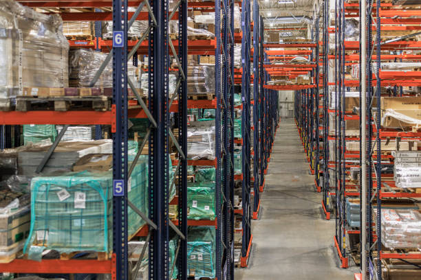 istock Shelves with goods in a modern warehouse. 1472835320