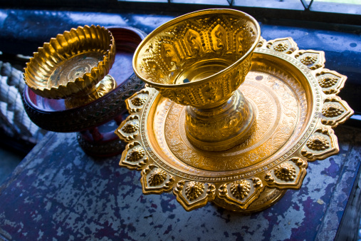 Religious offering plate in a temple in Thailand.