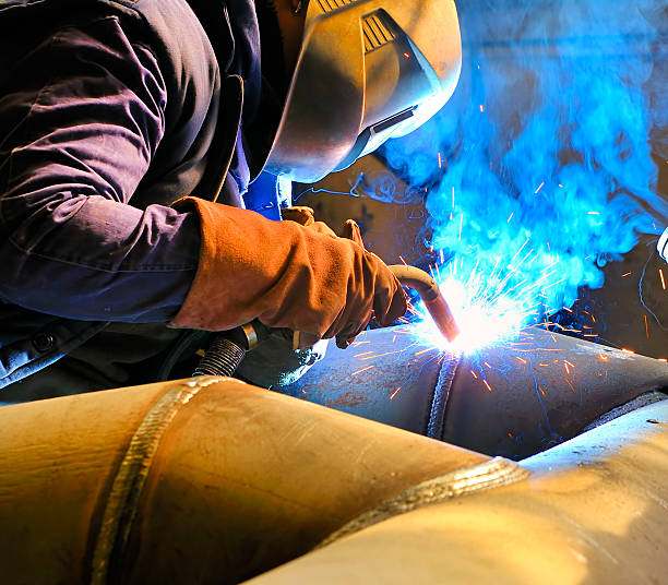 Cutting metal with mig welder stock photo