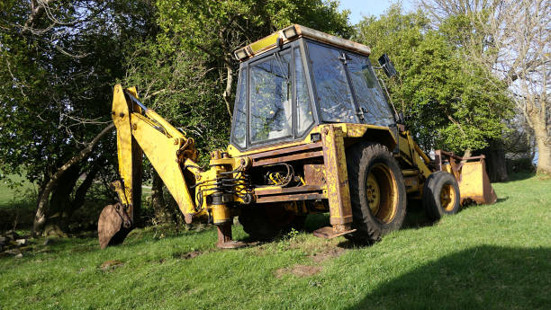 istock Old Yellow Digger on farm in Ireland 1472842417