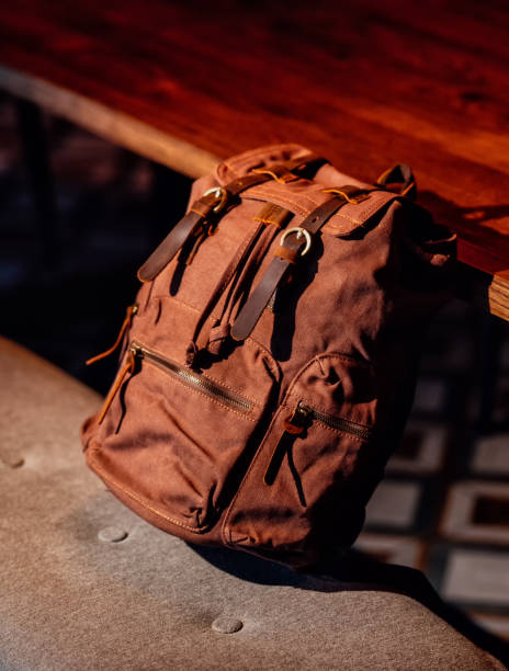 istock Canvas Backpack accessories in interior background. Canvas bag for travelers. Hipster's backpack 1472843760
