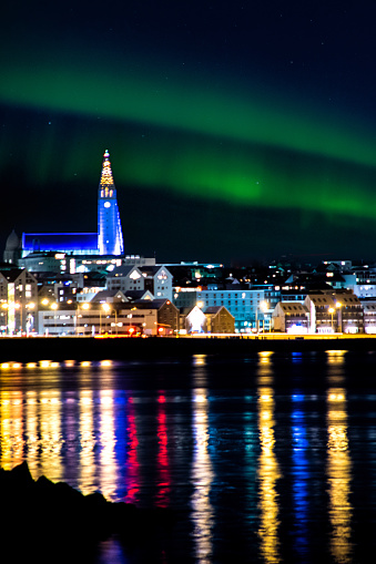 Reykjavík skyline by night with northern lights with Hallgrimskirkja