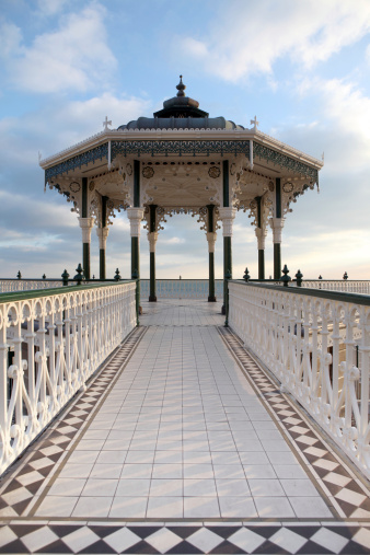 Victorian bandstand by brighton beach in sussex england. metal construction and pavilion