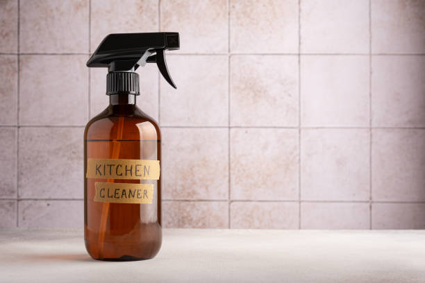 istock Spray bottle of kitchen cleaner on tile background 1472845781