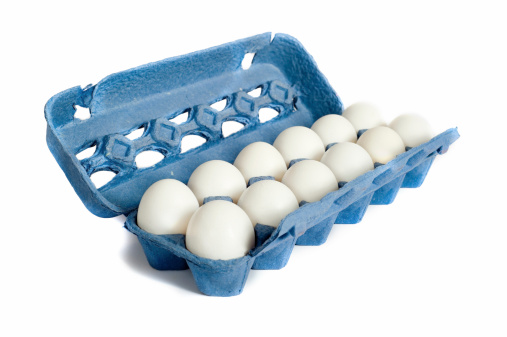Farm Fresh Egg on a white background in a blue carton