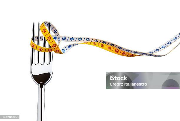 Diet Concept Represented With A Fork And Measuring Tape Stock Photo - Download Image Now
