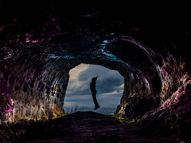 istock the courageous person's successful trip through dark caves 1472850228