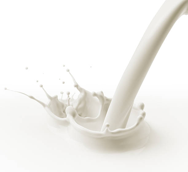 istock Stream of milk pouring and splashing on surface 147285089