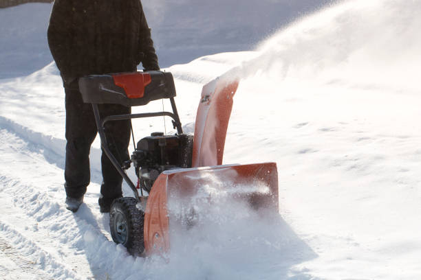 istock A portable snow blower powered by gasoline. 1472851106