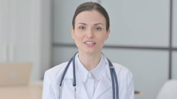 istock Young Doctor Talking on Online Video Call 1472852483