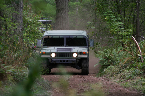 Humvee driving on a dirt road