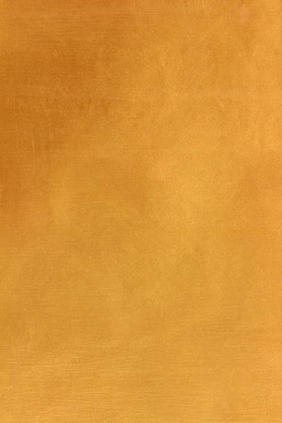 istock Gold or yellow paint on cement wall texture or background 1472854464