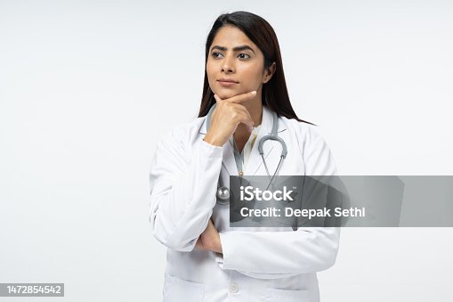 istock Cheerful happy doctor with crossed hands on white background stock photo 1472854542