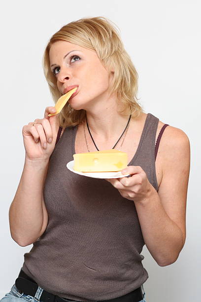 Woman and cheese stock photo