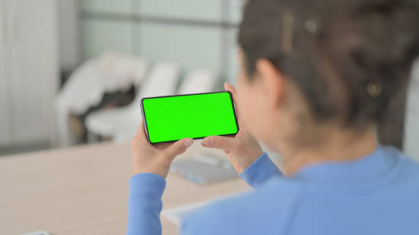 istock Indian Woman Holding Smartphone with Chroma Key Screen 1472859285