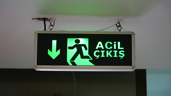 emergency exit sign hanging on the wall high resolution stock photo turkey