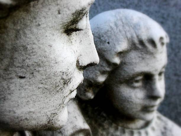 Granite faces of a mother and child