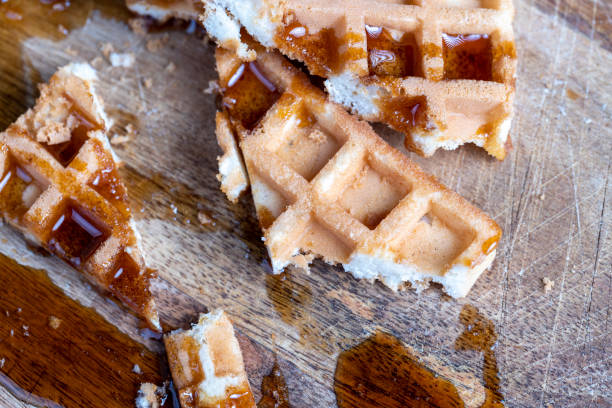 istock Soft fresh waffles with bee honey close-up 1472861729