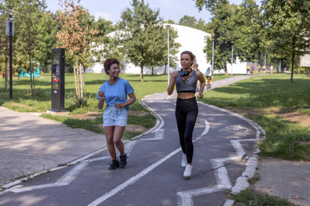 istock Beautiful active friends jogging together 1472862787