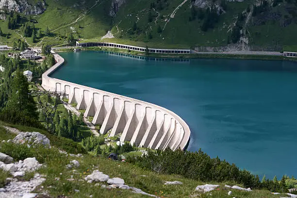 West dam of reservoir Lago di Fedaia under Marmolada, Dolomiti, Italy