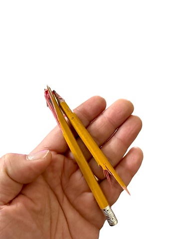Hand holding crack pencil