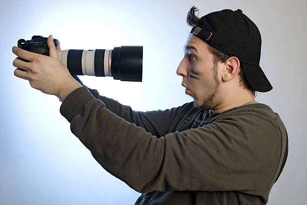 istock Young man with a photo camera 147286539