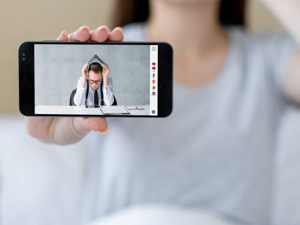 istock work overload video call tired colleague on phone 1472865880
