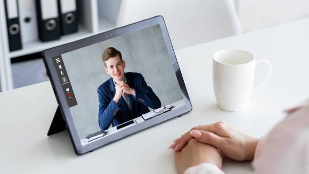 istock video interview business partners online on tablet 1472865954