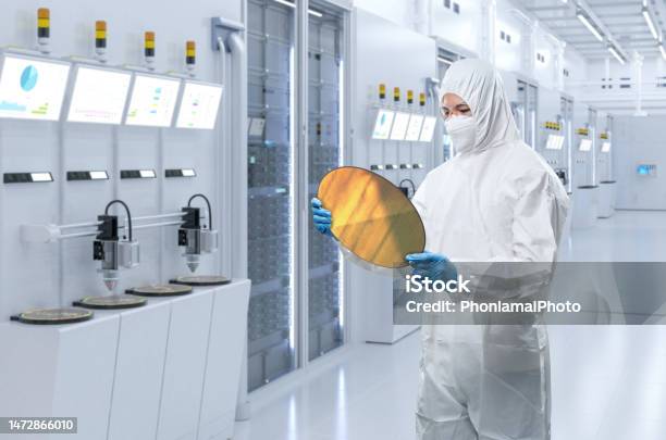 Worker Or Engineer Wears Medical Protective Suit Or Coverall Suit With Silicon Wafer Stock Photo - Download Image Now