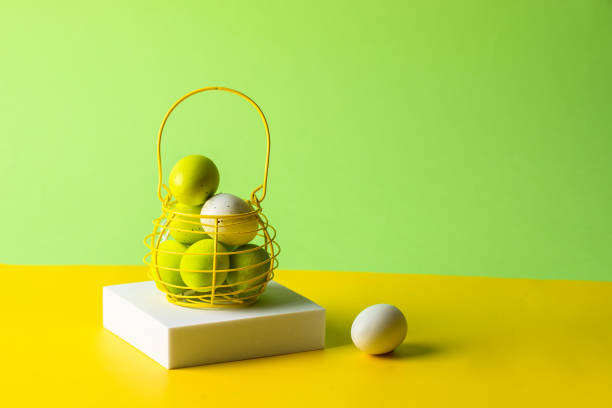istock Easter eggs into the basket on the platform on green background for happy easter concept. 1472866115