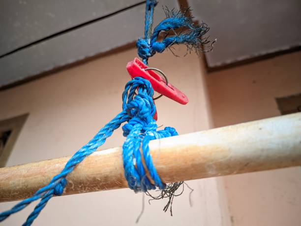 istock closeup a long bamboo stick tied by a blue raffia string with a red clothespin 1472870140