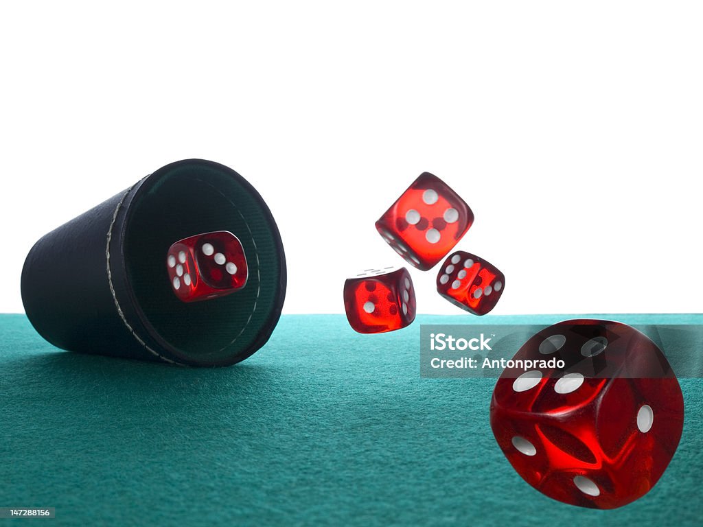 Dices and shaker Five red dices after being thrown from the shaker. Dice Stock Photo