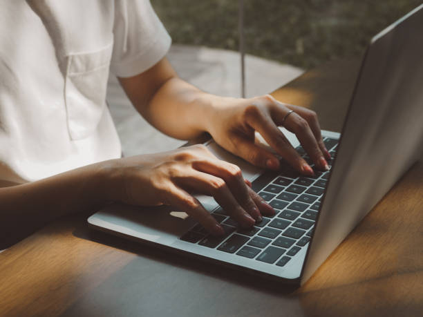 istock Woman typing documents or searching on laptop 1472884728